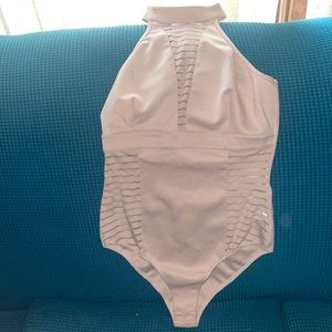 Blush pink Charlotte Russe bodysuit, size medium mush sides and mesh in front